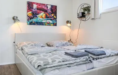 a bed with pillows on it in a room at D'azur in Aalsmeer