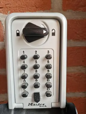 a close up of a remote control attached to a brick wall at Southpoint Zandvoort & private parking in Zandvoort