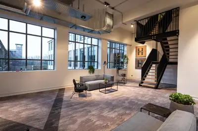 a living room with a couch and a table at Hilversum City Apartments in Hilversum
