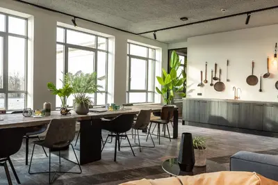 a dining room with a large table and chairs at Hilversum City Apartments in Hilversum