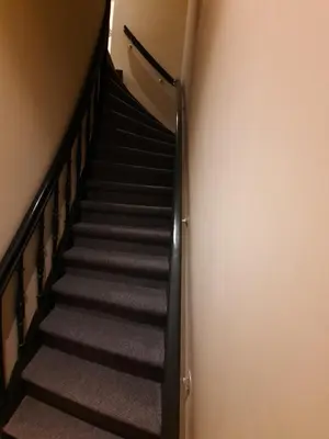 a staircase in a building with a stair case at RoomWest in Amsterdam