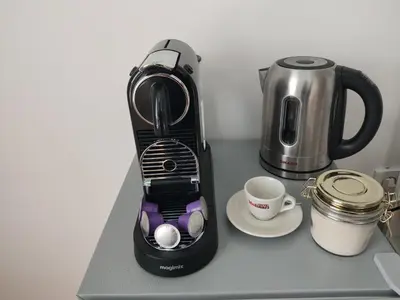 a coffeemaker sitting on a counter next to a coffee maker at B&B Hart van Leiden in Leiden