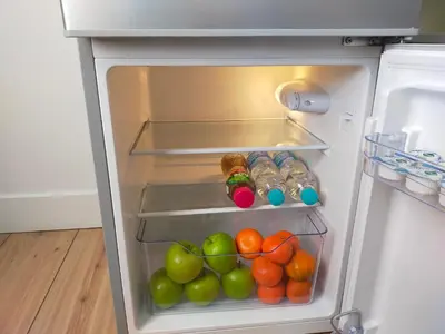an open refrigerator filled with lots of fruits and vegetables at B&B Hart van Leiden in Leiden