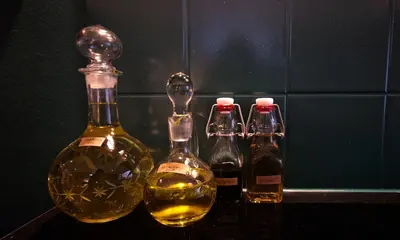 three bottles of wine sitting on top of a table at Have a nice stay! - Le Souterrain in Noordwijk aan Zee
