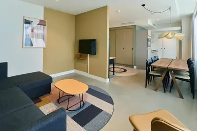 a living room with a couch and a table at Cityden BoLo District in Amsterdam