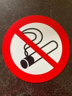 a red prohibitory sign on a table at Studio Zonnehoek Schoorl in Schoorl