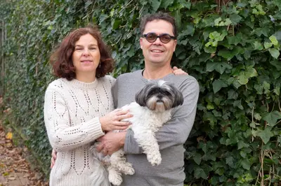 a man and a woman holding a small dog at Studio Zonnehoek Schoorl in Schoorl