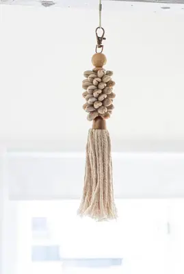a tassel ornament hanging from a ceiling at Tiny House Lindenhouse in Heemstede