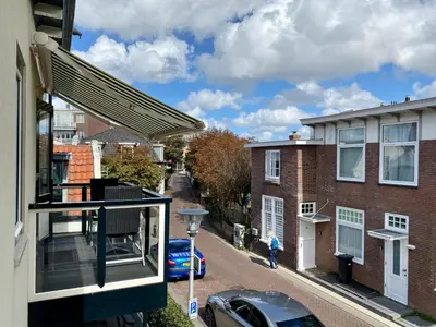 an apartment balcony with a view of a street at Mevira Appartement in Zandvoort