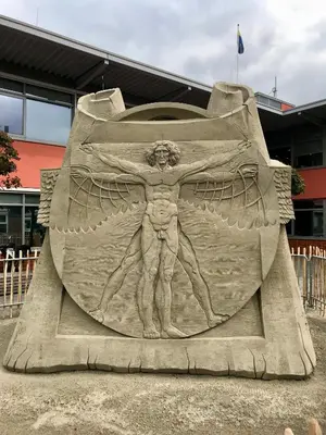 a sand sculpture of a man with wings at Mevira Appartement in Zandvoort