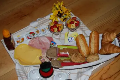a tray of food with bread and cheese and other foods at Bed&Brood De StraVerdonk in Graft