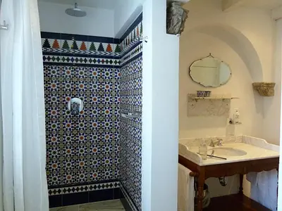 a bathroom with a shower and a sink at Ons Buiten in Bergen