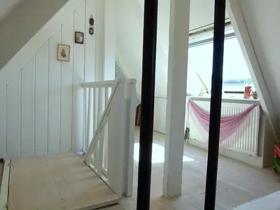 a staircase in a house with a window at Ons Buiten in Bergen