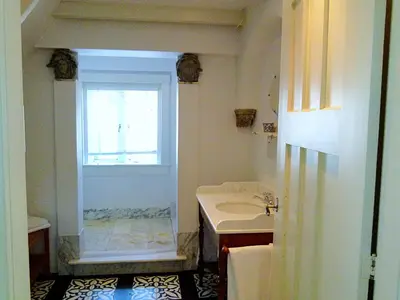 a bathroom with a sink and a window at Ons Buiten in Bergen
