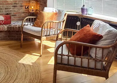 a living room with two chairs and a couch at Have a nice stay! - Strand Vakantiehuis Noordwijk in Noordwijk aan Zee