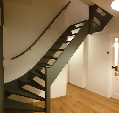 a black and white staircase in a room at Have a nice stay! - Strand Vakantiehuis Noordwijk in Noordwijk aan Zee