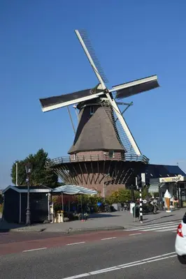 a windmill sitting on the side of a street at Morpheus in Amsterdam