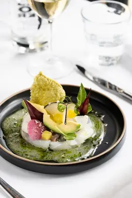 a plate of food with eggs and bread on a table at Ysbrantsz Boutique Hotel in Hoorn