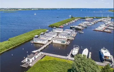 an aerial view of a marina with boats in the water at Cozy Ship In Aalsmeer With Wifi in Aalsmeer