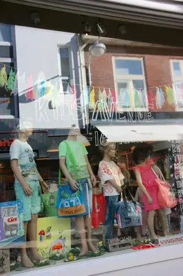 a group of people standing in a store window at Zandvoort Central Apartment in Zandvoort