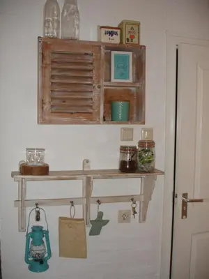 a shelf on a wall with a shelf at Sea in Egmond aan Zee