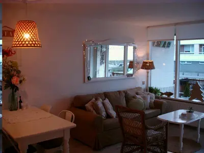 a living room with a couch and a table at Sea in Egmond aan Zee