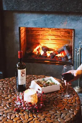 a bottle of wine and a box of food and a glass at De Ware Jacob Boutique Hotel in Amsterdam