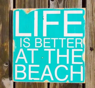 a sign that reads life is better at the beach at In The Heart of Zandvoort in Zandvoort