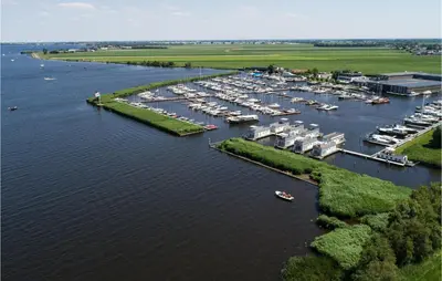 an aerial view of a marina with boats in the water at Lovely Ship In Aalsmeer With Kitchen in Aalsmeer