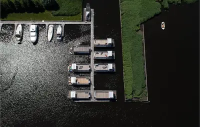 an overhead view of a dock with boats in the water at Lovely Ship In Aalsmeer With Kitchen in Aalsmeer