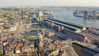 an aerial view of a city with a river at Private studio, patio garden and free car parking in Amsterdam