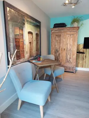 a dining room with a table and two chairs at Studio Pipper in Zandvoort