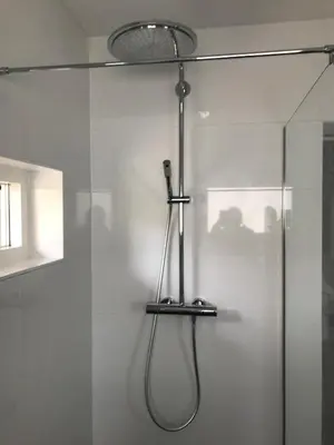 a shower in a bathroom with a glass door at Studio Pipper in Zandvoort