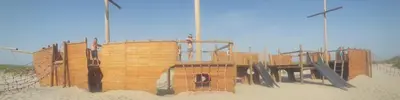 a wooden building in the sand on the beach at 4T4 Apartment C in Egmond aan den Hoef