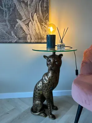 a cat table with a candle on top of it at Amsterdam Beach Apartment 34, Private Garden in Zandvoort