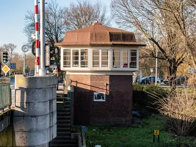 a building with a large window on top of it at SWEETS - Willemsbrug in Amsterdam