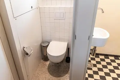 a bathroom with a toilet and a sink at SWEETS - Omvalbrug in Amsterdam