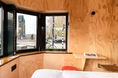 a room with a bed and a window at SWEETS - Omvalbrug in Amsterdam