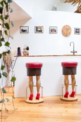 a pair of legs in red shoes on skis in a room at B&B Houseboat Amsterdam in Amsterdam