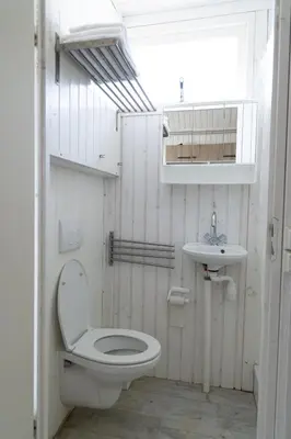 a bathroom with a toilet and a sink at Willy Zuid in Katwijk aan Zee