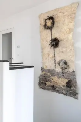 a pillow with two dandelions on a wall at Gorgeous And Stylish Place For Two In Hip West! in Amsterdam