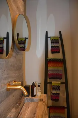 a bathroom with a sink and a mirror at 'Room Eleven' aan de Vecht in Vreeland