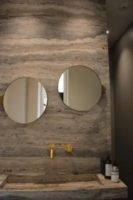 two mirrors on the wall of a bathroom at 'Room Eleven' aan de Vecht in Vreeland