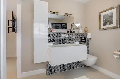 a bathroom with a white sink and a toilet at B&B Modern Times in Amsterdam
