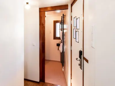 a hallway with a door leading to a bathroom at SWEETS - IJdoornlaanbrug in Amsterdam