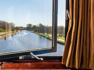 a view of a river from a window at SWEETS - IJdoornlaanbrug in Amsterdam