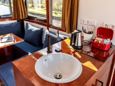 a bathroom with a sink in a train room at SWEETS - IJdoornlaanbrug in Amsterdam