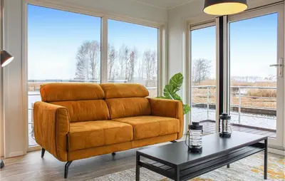 a living room with a couch and a table at Bluff in Aalsmeer
