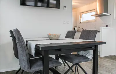 a dining room table and chairs in a kitchen at Bluff in Aalsmeer