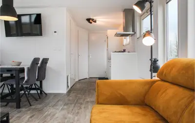 a living room with a couch and a table at Bluff in Aalsmeer